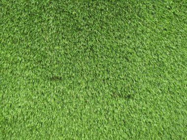 Yapay yeşil çimen arkaplanı. Fotoğrafı kapat..