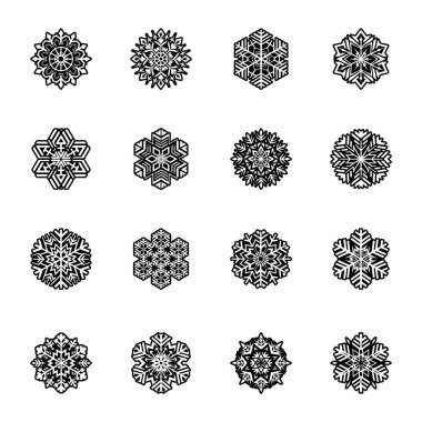 Beyaz arkaplanda siyah kar taneleri