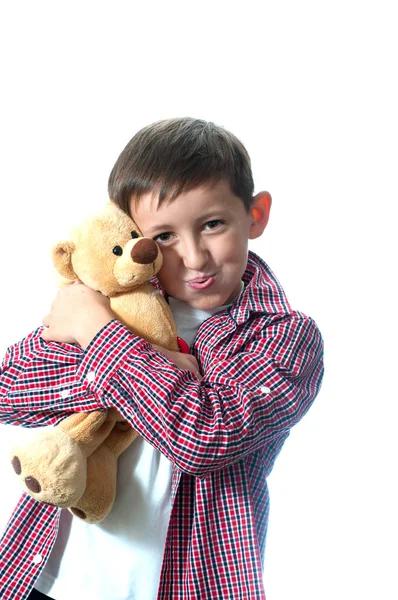 Happy young boy with teddy-bear — Stock Photo, Image