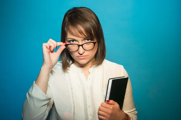 Strict teacher woman with glasses, portrait studio — Stock Photo, Image