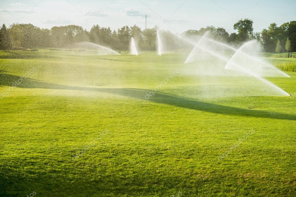 Fountains watered green golf course Stock Photo by ©absurdov 105285488