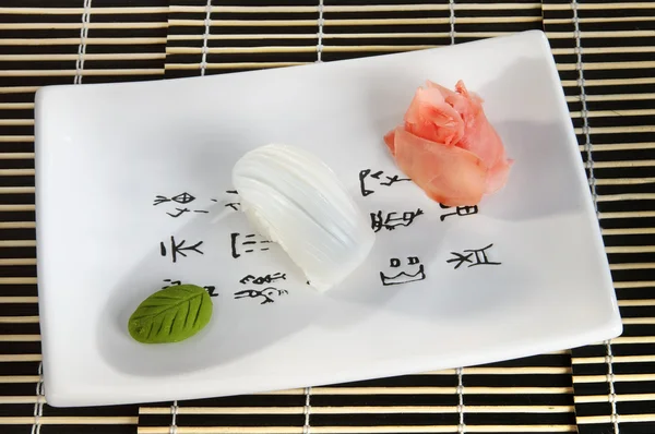 Sushi menu: scallops with wasabi and ginger on a plate — Stock Image Sushi menu: scallops with wasabi and ginger on a plate Royalty Free Stock Images