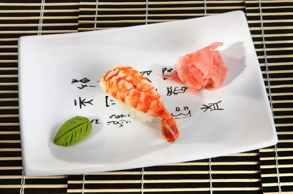 Sushi menu: shrimp with wasabi and ginger on a plate — Stock Image Sushi menu: shrimp with wasabi and ginger on a plate Stock Photo