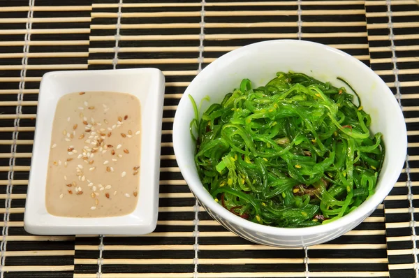 Sushi menu: salad of seaweed with sauce. — Stock Image Sushi menu: salad of seaweed with sauce. Stock Image