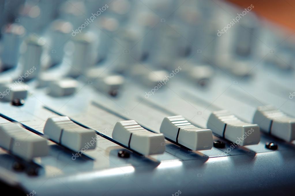 Mixers on the remote control in recording studio Stock Photo by