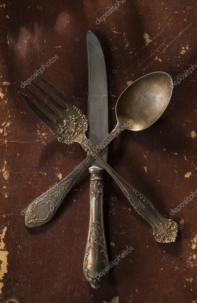 Vintage silver spoon fork and knife decorated with different patterns