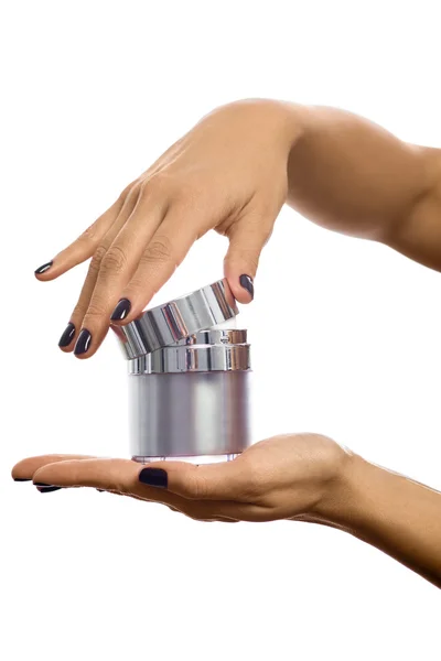 Hands opening cosmetic jar — Stock Photo, Image