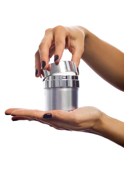 Hands opening cosmetic jar — Stock Photo, Image
