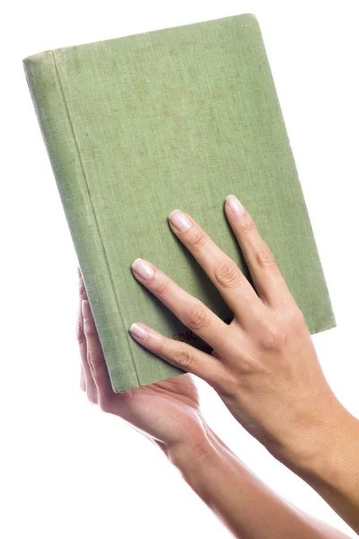 Eski bir kitap holding eller