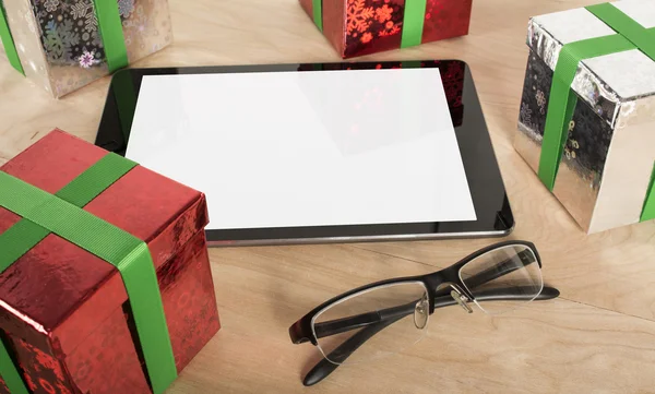 Christmas Gift with Tablet in wood Background — Stock Photo, Image