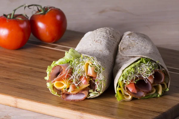 Wrapped tortilla sandwich rolls — Stock Photo, Image