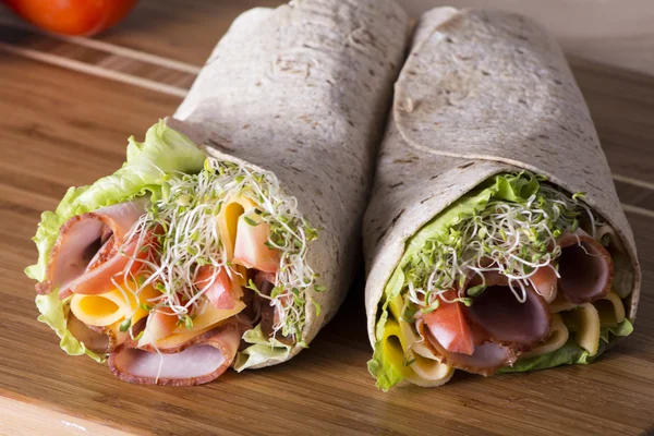 Wrapped tortilla sandwich rolls — Stock Photo, Image