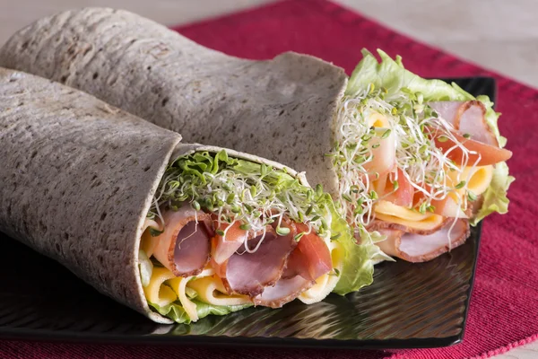 Wrapped tortilla sandwich rolls — Stock Photo, Image