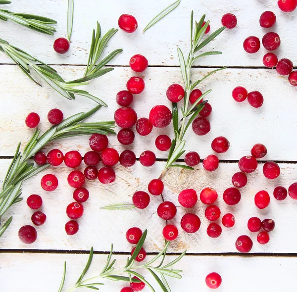 Cranberries and rosemary — Stock Photo, Image