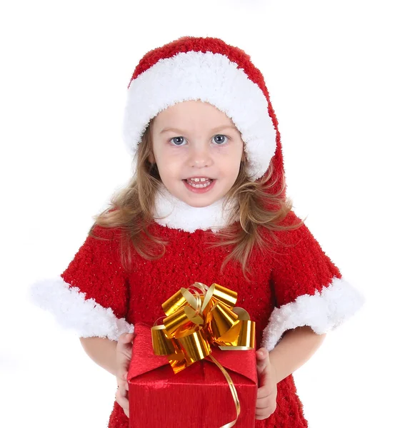 Cute little girl in a New Year's cap with a gift — Stock Photo, Image