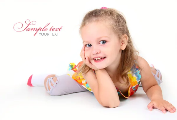 Cute little girl lying on the floor — Stock Photo, Image