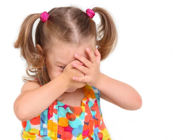 Little girl covers her face with her hands — Stock Photo, Image
