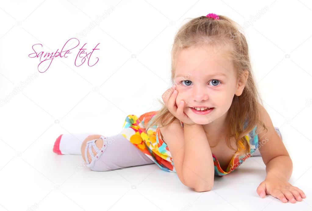 Cute little girl lying on the floor