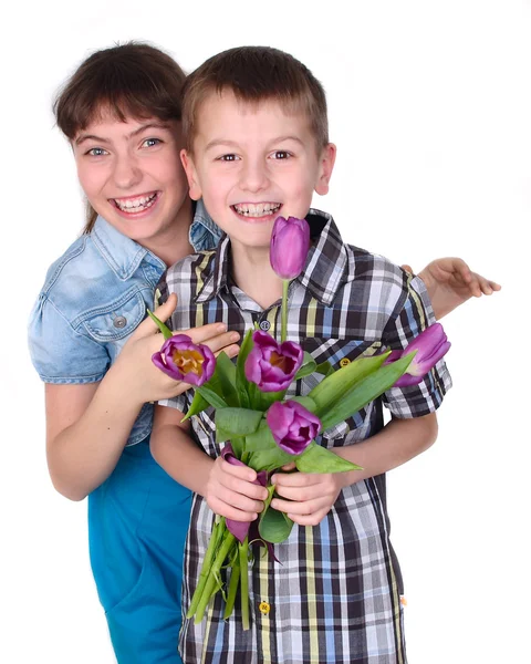 Boy and girl with a bouquet of flowers — Stock Photo, Image