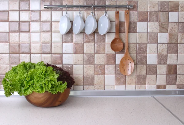 Modern kitchen with cozy lighting, and food ingredients on the counter top — Stock Photo, Image