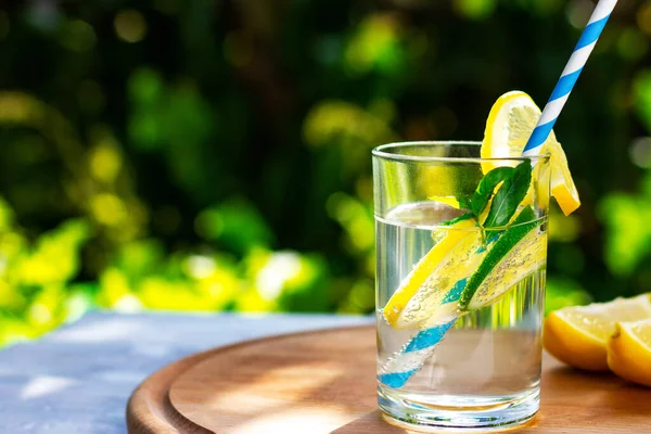 Summer cool lemon and lime drink with drinking straw