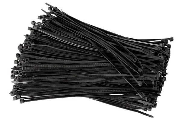 Black cable ties on a white background. Plastic ties. Isolate on white. — Stock Photo, Image