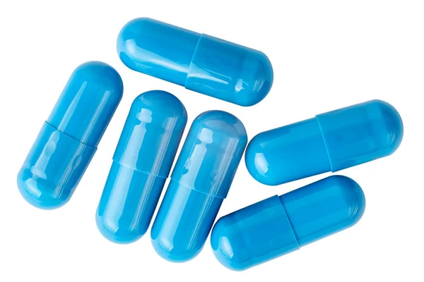 Niebieskie pigułki na białym tle. Tabletki medyczne. Kapsułki witaminy. Izolacja na białym tle. — Zdjęcie stockowe