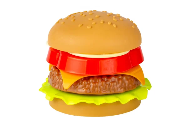 Hambúrguer de plástico sobre fundo branco. Não é comida a sério. Cheeseburger de brinquedo. Isolar em um fundo branco. — Fotografia de Stock