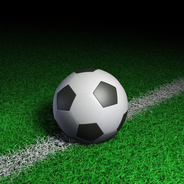 Yeşil çimlerde futbol topu