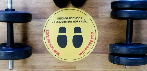 'KEEP SAFE DISTANCE,' find this step stickers of Covid-19 precaution everywhere