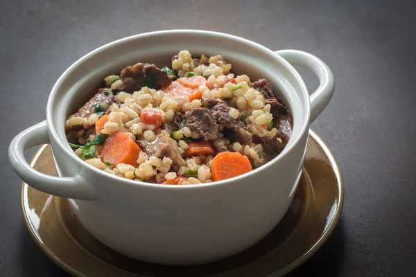 Homemade beef and barley soup. Grey background. Copy space. — Stock Image Homemade Beef Barley Soup Grey Background Copy Space Stock Photo