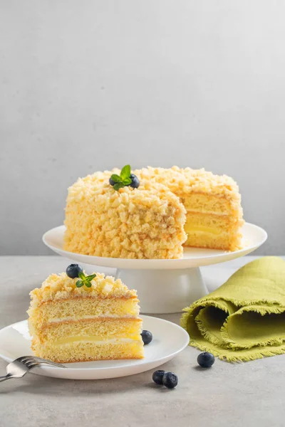 Mimosa cake - traditional Italian sponge cake for celebration of International  Women\'s Day.  Vertical image, light background.