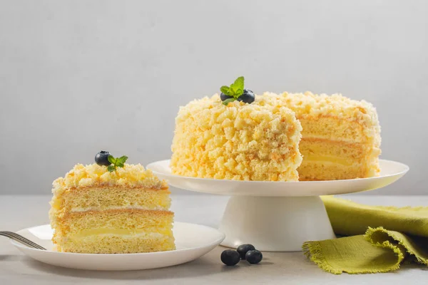 Mimosa cake - traditional Italian sponge cake for celebration of International  Women\'s Day.  Horizontal image, light background.