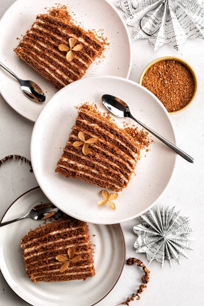 Chocolate cake with multiple layers and custard cream with whipped cream. Vertical image.