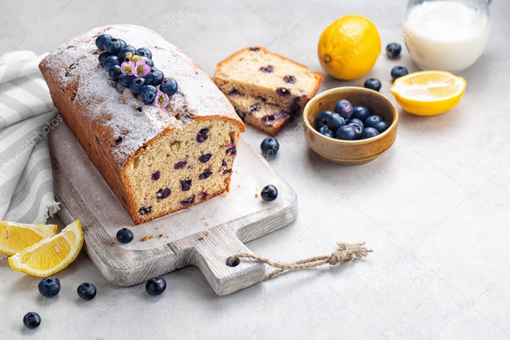 Breakfast with homemade fruit cake with blueberry and lemon. Diagonal composition. Copy space.