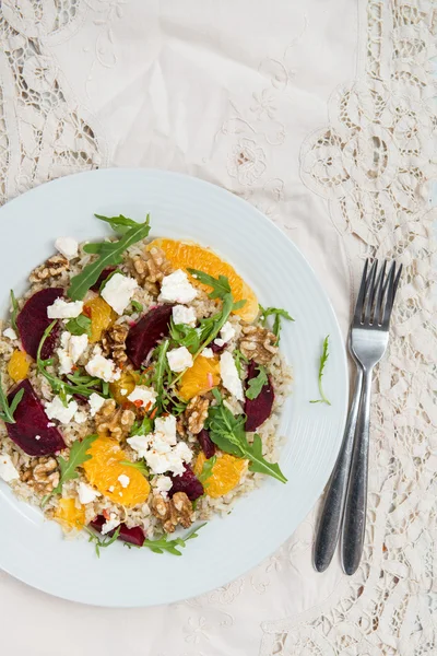 Warm Healthy quinoa, brown rice, cooked beetroot and orange sala — Stock Photo, Image