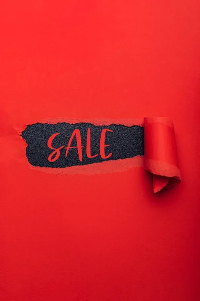 Sale text in paper hole — Stock Photo, Image