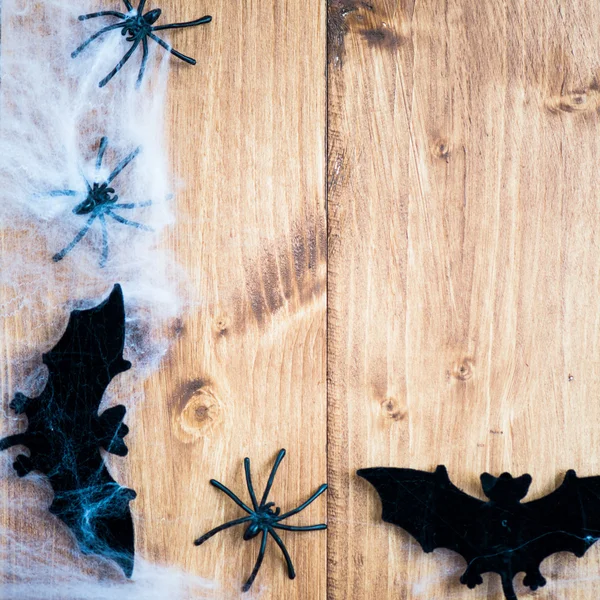 Halloween Symbols Bats, Web and Black Spiders on Wooden Backgrou Royalty Free Stock Photos