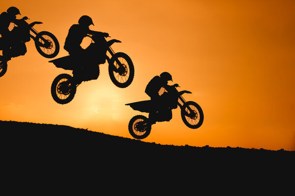 motorcycle silhouette are jumping