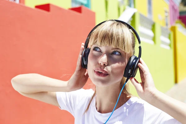 Beautiful woman lost in music — Stock Photo, Image