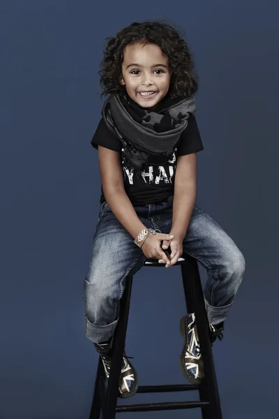 Cool kid on stool in studio — Stock Photo, Image