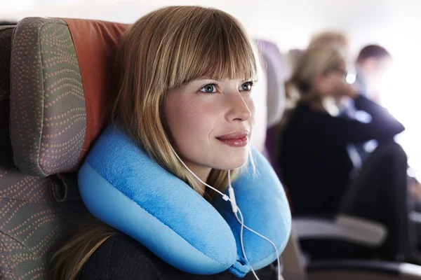 Woman passenger on airplane — Stock Photo, Image