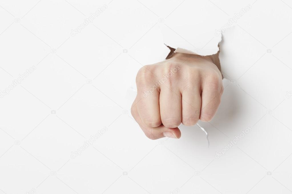 Punching through white paper Stock Photo by ©sanneberg 103926898