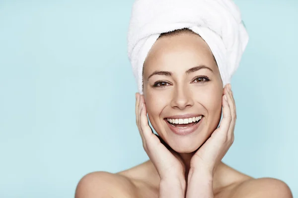 Smiling beautiful woman in towel