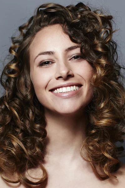 Curly haired beautiful woman — Stock Photo, Image