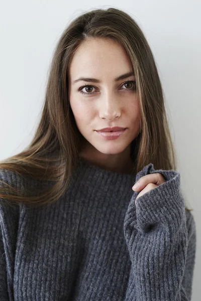 Gorgeous woman in grey sweater — Stock Photo, Image