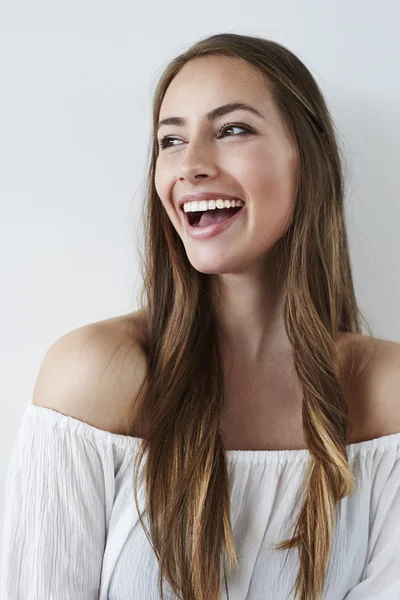 Beautiful laughing lady in white — Stock Photo, Image