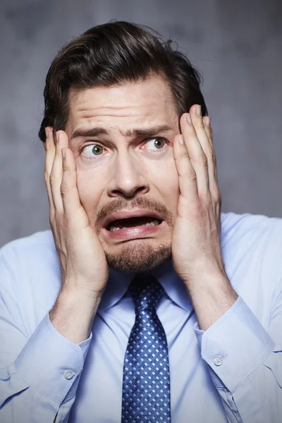 Worried businessman in studio — Stock Photo, Image