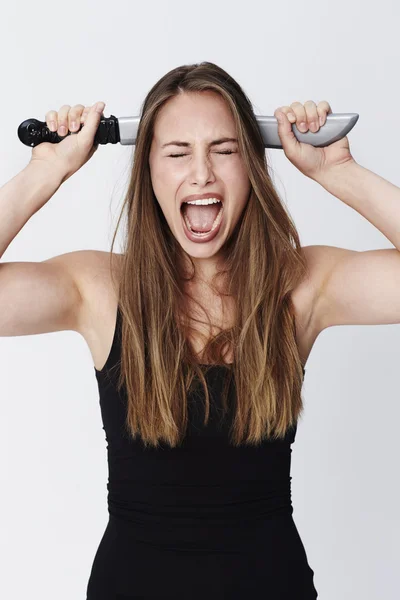 Screaming woman with knife — Stock Photo, Image