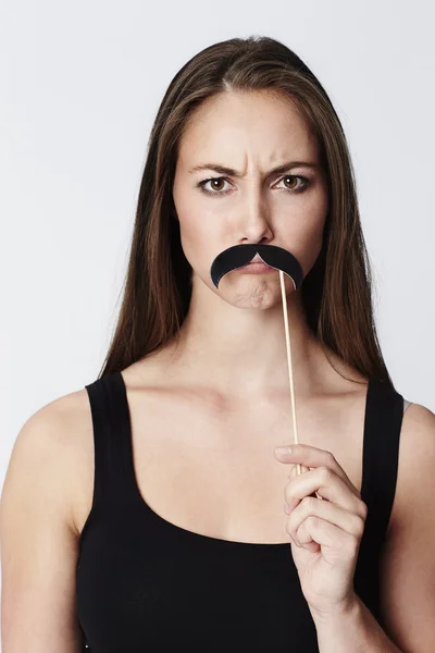 Beautiful woman with false moustache — Stock Photo, Image